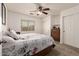 Bright bedroom with white walls, plush carpeting, and a stylish ceiling fan at 22191 W Tonto St, Buckeye, AZ 85326
