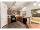 Functional kitchen layout with wood cabinets and direct access to the backyard at 22191 W Tonto St, Buckeye, AZ 85326