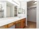 A lovely bathroom features a dual-sink vanity, walk-in shower, and walk-in closet at 2433 W Hayden Peak Dr, San Tan Valley, AZ 85144
