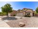 Single Gathering home with desert landscaping, a 2-car garage, and a tree in the front yard at 2433 W Hayden Peak Dr, San Tan Valley, AZ 85144