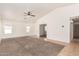 Spacious living room features neutral finishes, carpet, and lots of natural light at 2433 W Hayden Peak Dr, San Tan Valley, AZ 85144