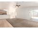 Spacious living room with open layout, neutral walls and a seamless transition to the kitchen at 2433 W Hayden Peak Dr, San Tan Valley, AZ 85144