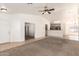 Open living room with neutral carpet, ample natural light, and easy access to kitchen at 2433 W Hayden Peak Dr, San Tan Valley, AZ 85144