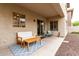 Covered back patio with outdoor seating and a view of the low-maintenance backyard at 2533 W Cordia Ln, Phoenix, AZ 85085