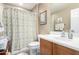 Bathroom with neutral walls, a white toilet, a vanity, and a shower with a printed curtain at 2533 W Cordia Ln, Phoenix, AZ 85085