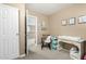 Cozy Bedroom with neutral walls, plush carpet, a changing table, and a peek into the hallway at 2533 W Cordia Ln, Phoenix, AZ 85085