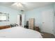 Light blue bedroom with white door and light streaming through the blinds at 2533 W Cordia Ln, Phoenix, AZ 85085