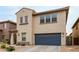 Stylish two-story house showcasing a blue garage door and stucco facade at 2533 W Cordia Ln, Phoenix, AZ 85085