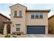 Stylish two-story house showcasing a blue garage door and stucco facade at 2533 W Cordia Ln, Phoenix, AZ 85085