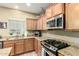 Kitchen with modern appliances, granite counters, and ample cabinet space at 2533 W Cordia Ln, Phoenix, AZ 85085