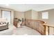 A carpeted landing features a wooden railing with pictures hanging on the wall at 2533 W Cordia Ln, Phoenix, AZ 85085