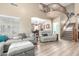 Inviting living room with soaring ceilings, a staircase, and wood laminate flooring at 2533 W Cordia Ln, Phoenix, AZ 85085