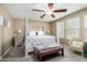 The primary bedroom features neutral walls, carpeted floors, and a ceiling fan at 2533 W Cordia Ln, Phoenix, AZ 85085