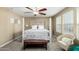 The primary bedroom features neutral walls, carpeted floors, and a ceiling fan at 2533 W Cordia Ln, Phoenix, AZ 85085