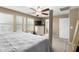 The primary bedroom features neutral walls, carpeted floors, and a ceiling fan at 2533 W Cordia Ln, Phoenix, AZ 85085