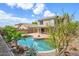 Enjoy this backyard oasis with a refreshing pool, mature landscaping and covered patio at 25825 N 65Th Ave, Phoenix, AZ 85083