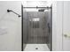 Modern bathroom features a tiled shower with glass door at 25825 N 65Th Ave, Phoenix, AZ 85083