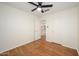 Bedroom featuring hardwood floors, ceiling fan, closet, and ensuite bath at 25825 N 65Th Ave, Phoenix, AZ 85083