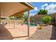 Spacious covered patio perfect for outdoor entertaining with views of the pool and manicured landscaping at 25825 N 65Th Ave, Phoenix, AZ 85083