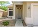 Inviting front entrance featuring an ornate security door, address numbers, and desert landscaping at 25825 N 65Th Ave, Phoenix, AZ 85083
