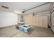 Spacious garage with ample storage cabinets, shelving and room for your vehicles at 25825 N 65Th Ave, Phoenix, AZ 85083