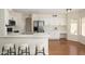 Bright kitchen boasting marble countertops, stainless steel appliances, and a cozy breakfast bar with seating at 25825 N 65Th Ave, Phoenix, AZ 85083