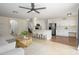 Open-concept kitchen and living area featuring stainless steel appliances, breakfast bar, and ample seating at 25825 N 65Th Ave, Phoenix, AZ 85083