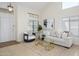 Bright living room with neutral decor, large windows, and a comfortable seating area that is very inviting at 25825 N 65Th Ave, Phoenix, AZ 85083