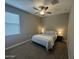 Bedroom with natural light, a ceiling fan, and closet with sliding doors at 30395 W Mitchell Ave, Buckeye, AZ 85396