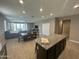 Open-concept layout showcasing the kitchen, dining, and living areas at 30395 W Mitchell Ave, Buckeye, AZ 85396