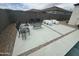 Backyard with a concrete patio that includes outdoor furniture and desert landscaping at 30395 W Mitchell Ave, Buckeye, AZ 85396