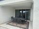 Covered patio with outdoor dining table and chairs, and access to the backyard at 30395 W Mitchell Ave, Buckeye, AZ 85396