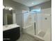 Modern bathroom shower showcasing a glass enclosure and built-in seating at 30395 W Mitchell Ave, Buckeye, AZ 85396