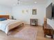 Well-lit bedroom featuring hardwood floors and minimalist decor that gives the room a refreshing look at 309 E Huntington Dr, Tempe, AZ 85282