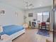 Bright bedroom features hardwood floors, ceiling fan, full size bed frame, and a study area at 309 E Huntington Dr, Tempe, AZ 85282