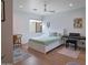 Cozy bedroom with hardwood floors, a ceiling fan, and full size bed with a study area at 309 E Huntington Dr, Tempe, AZ 85282