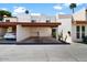 White home exterior with a two-car carport, desert landscaping, and convenient parking at 309 E Huntington Dr, Tempe, AZ 85282