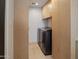 Well-organized laundry room with built-in cabinets and modern washer and dryer at 309 E Huntington Dr, Tempe, AZ 85282