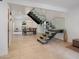 Bright living space with open staircase, glass railings, and stylish dining area bathed in natural light at 309 E Huntington Dr, Tempe, AZ 85282