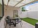 Backyard patio with pavers, artificial grass, and a pergola that offers partial shade at 309 E Huntington Dr, Tempe, AZ 85282