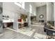Spacious common area with a kitchen, bar seating, high ceilings, fireplace, and stylish decor for residents at 3131 N Central Ave # 6010, Phoenix, AZ 85012