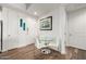Bright dining area with a modern glass table, white chairs, and artwork, creating a stylish space at 3131 N Central Ave # 6010, Phoenix, AZ 85012