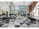Well-equipped fitness center with treadmills, exercise bikes, and ample natural light from large windows at 3131 N Central Ave # 6010, Phoenix, AZ 85012