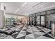 Spacious gym featuring weightlifting equipment, mirrors, and large windows with an inviting workout area at 3131 N Central Ave # 6010, Phoenix, AZ 85012