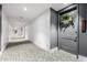 Well-lit hallway featuring patterned carpeting and access to various units, enhanced by neutral wall colors at 3131 N Central Ave # 6010, Phoenix, AZ 85012