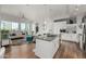 Open-concept kitchen with stainless steel appliances, an island with bar seating, and a clear view to living area at 3131 N Central Ave # 6010, Phoenix, AZ 85012