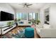 Stylish living room with city views, hardwood floors, modern furniture, and a bright, open atmosphere at 3131 N Central Ave # 6010, Phoenix, AZ 85012