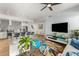 Open-concept living space with a kitchen island, hardwood floors, modern furniture, and ample natural light at 3131 N Central Ave # 6010, Phoenix, AZ 85012