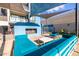 Stylish outdoor lounge area with comfortable blue seating, shade sails, and a contemporary fireplace feature at 3131 N Central Ave # 6010, Phoenix, AZ 85012