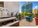 Chic outdoor patio with concrete seating, colorful lounge chairs, and potted plants creating a stylish entertainment space at 3131 N Central Ave # 6010, Phoenix, AZ 85012